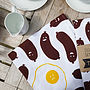 Silly Sausages Sensible Egg Tea Towel, thumbnail 1 of 2
